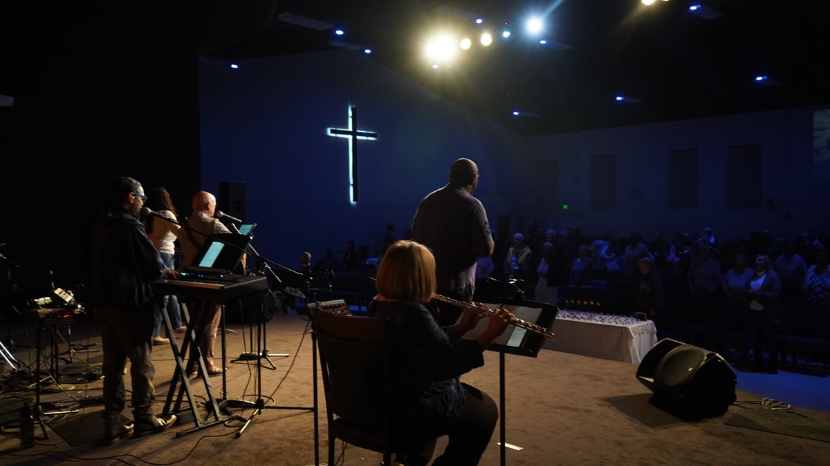 People gathering for Sunday worship at BBCC